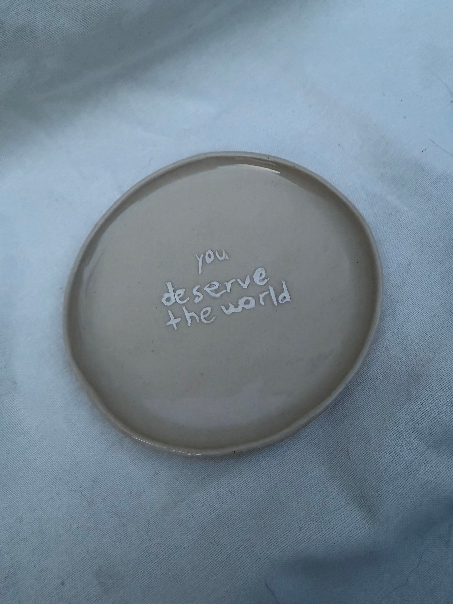 You deserve the world app plate